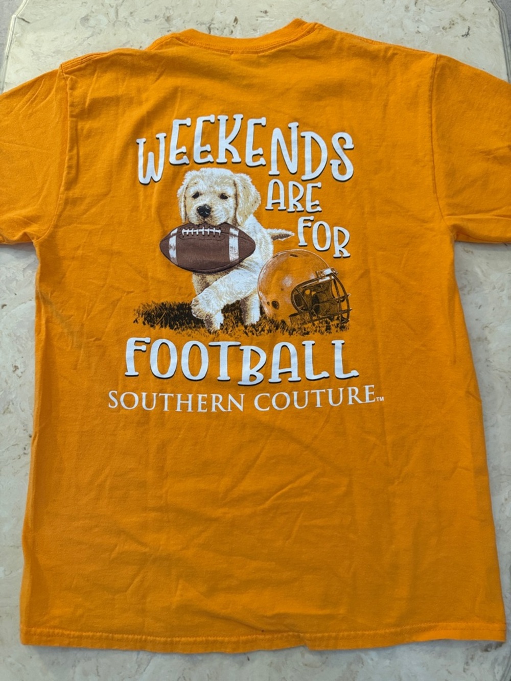 Orange ladies Tee with Puppy Football graphic